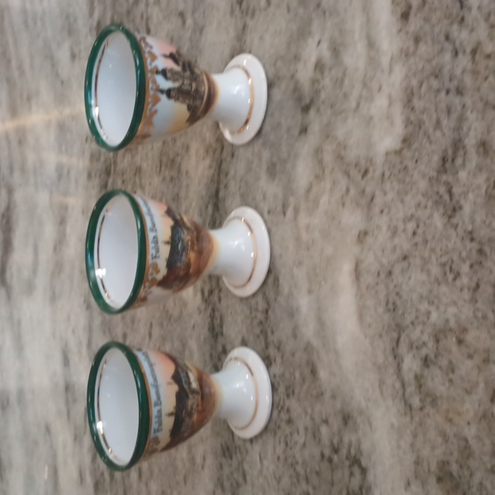 Three Gold accent German Shot Glasses.